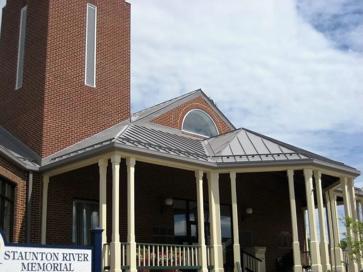 Skilled roofing craftsmen working on a residential roof in Navy